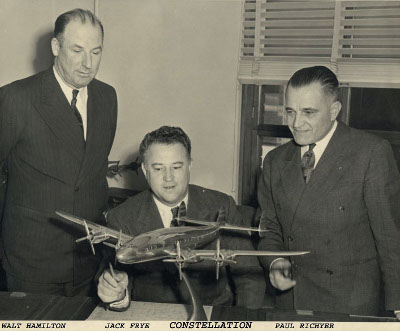 Walter Hamilton, Jack Frye and Paul Richter look at the new Lockheed Constellation... The Trans-Atlantic airliner that revolutionized the aviation world.