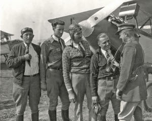 Paul Richter, after his 18,000 ft. record, getting a check-up. Jack Frye, second from left. 