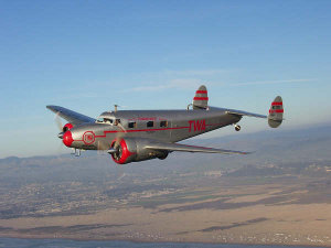 Lockheed 12 NC 18137 over Pismo dunes