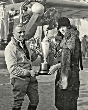 Mrs. Jacques Vinmont presents the "Silver Cup Perpetual Trophy."