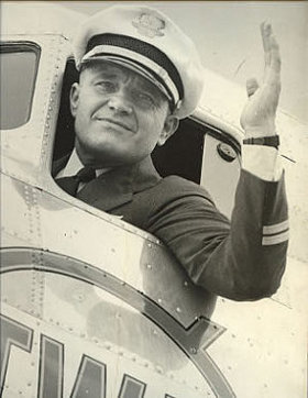 Paul Richter waving out of the cockpit window