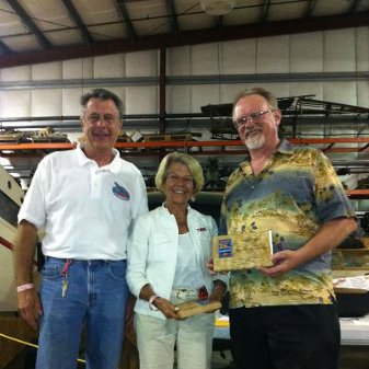 Ken Olsson, WAAAM coordinator, presents Curt Walters and Ruth Holden with both the Grand Champion and Peoples Choice Awards.